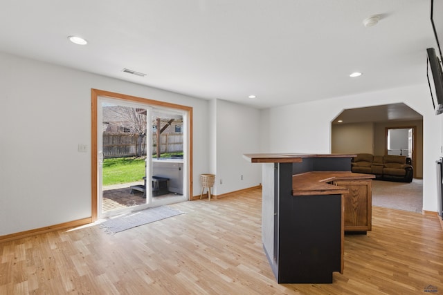 kitchen with light wood-style floors, baseboards, recessed lighting, and visible vents