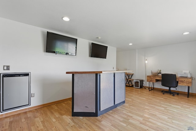 bar featuring baseboards, recessed lighting, and light wood finished floors