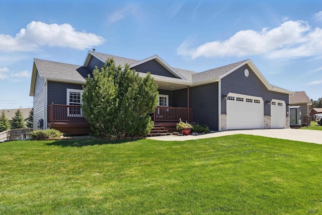 view of front of home with a garage, a front lawn, and concrete driveway