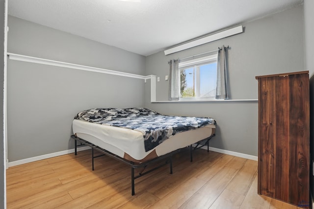 6406 Blue Spruce Ct, Black Hawk, SD 57718 - bedroom with baseboards and wood finished floors