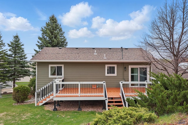 6406 Blue Spruce Ct, Black Hawk, SD 57718 - rear view of house with a lawn, a wooden deck, a shingled roof, and stairs