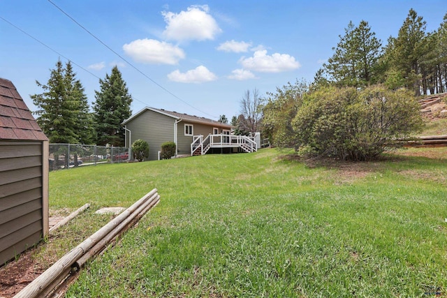 6406 Blue Spruce Ct, Black Hawk, SD 57718 - view of yard with stairs, fence, and a wooden deck