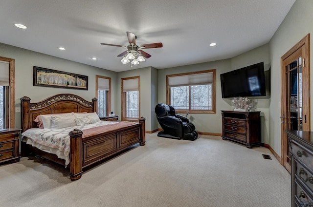6642 Carnoustie Ct, Rapid City, SD 57702 - bedroom featuring light carpet, baseboards, visible vents, and recessed lighting