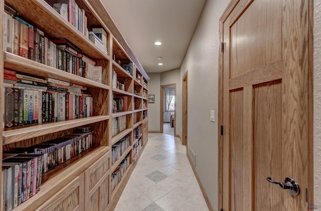 6642 Carnoustie Ct, Rapid City, SD 57702 - hallway with baseboards, light tile patterned floors, and recessed lighting