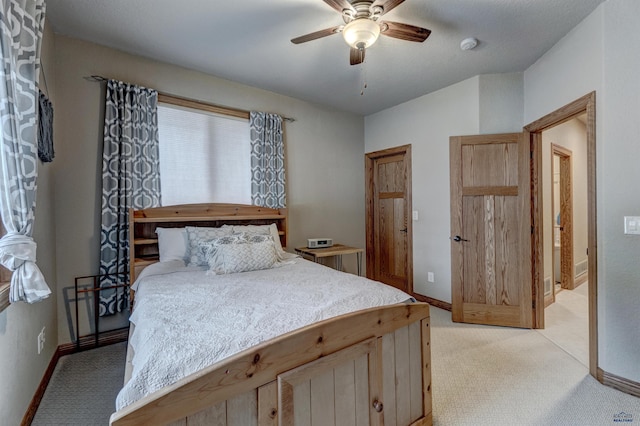 6642 Carnoustie Ct, Rapid City, SD 57702 - bedroom featuring light carpet, baseboards, and ceiling fan