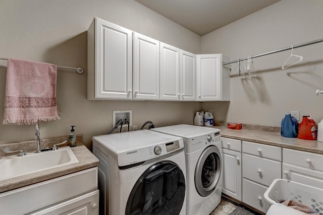 6642 Carnoustie Ct, Rapid City, SD 57702 - clothes washing area with washer and dryer, a sink, and cabinet space