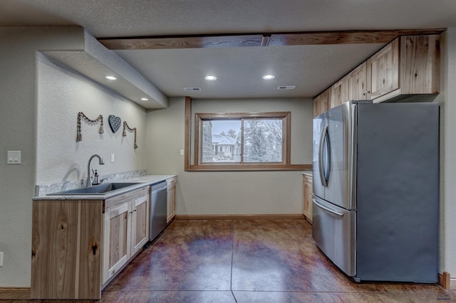 6642 Carnoustie Ct, Rapid City, SD 57702 - kitchen with a sink, stainless steel appliances, recessed lighting, light countertops, and baseboards