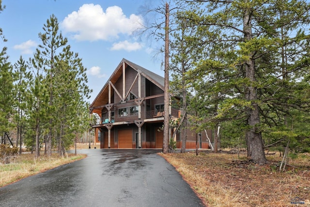 21298 Ridgewood Trl, Lead, SD 57754 - rustic home with a balcony and driveway