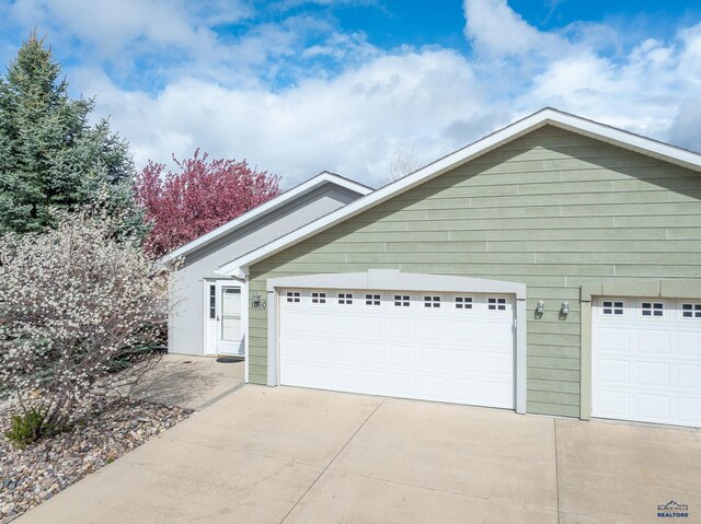 1960 Haycamp Ln, Rapid City, SD 57703 - view of property exterior with driveway and a garage