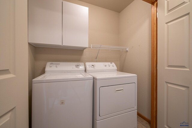 1960 Haycamp Ln, Rapid City, SD 57703 - laundry area featuring cabinet space and washer and dryer