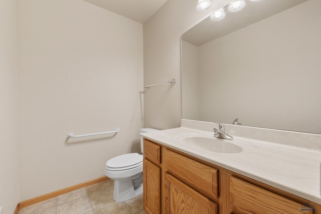 1960 Haycamp Ln, Rapid City, SD 57703 - bathroom featuring baseboards, vanity, and toilet