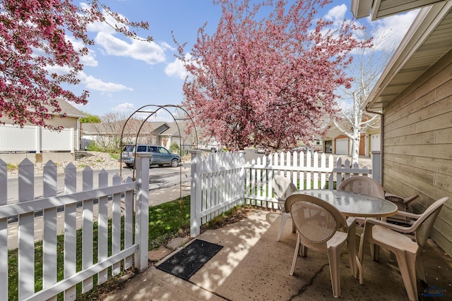 1960 Haycamp Ln, Rapid City, SD 57703 - view of patio / terrace featuring fence, outdoor dining space, and a residential view