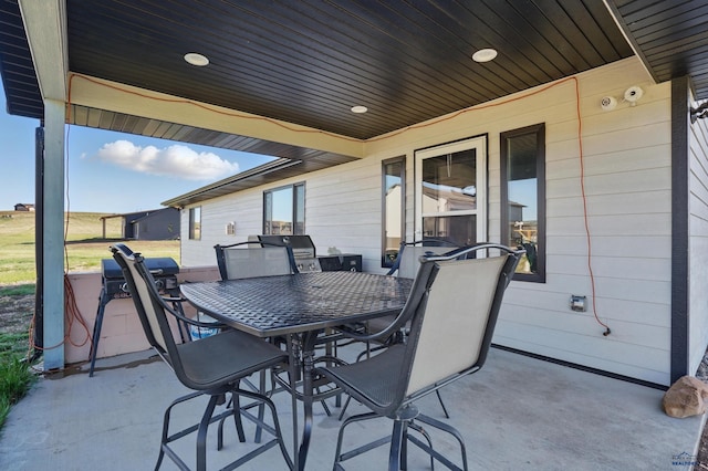 view of patio / terrace featuring outdoor dining area and grilling area