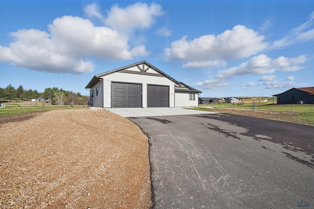 garage featuring driveway