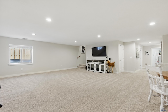 950 Summerfield Dr, Rapid City, SD 57703 - living area with stairway, light carpet, baseboards, and recessed lighting