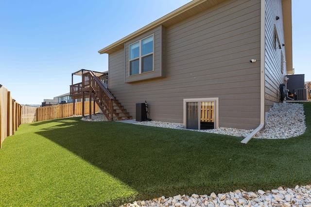 950 Summerfield Dr, Rapid City, SD 57703 - back of house with a lawn, stairway, a wooden deck, and a fenced backyard