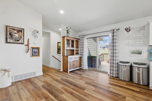 950 Summerfield Dr, Rapid City, SD 57703 - dining space featuring lofted ceiling, recessed lighting, baseboards, visible vents, and light wood-style floors