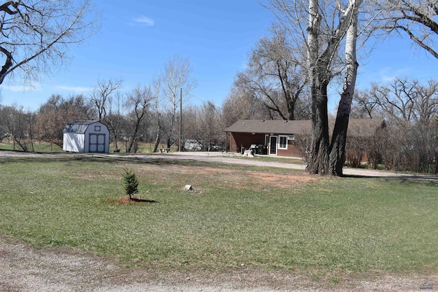2911 Orchard Ln, Rapid City, SD 57701 - view of yard featuring driveway, a shed, and an outbuilding