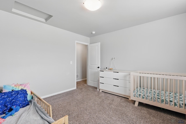 carpeted bedroom featuring baseboards