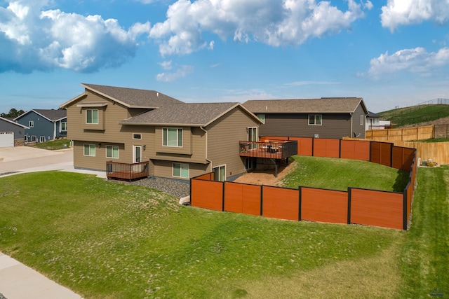rear view of house featuring a wooden deck, a residential view, and roof with shingles