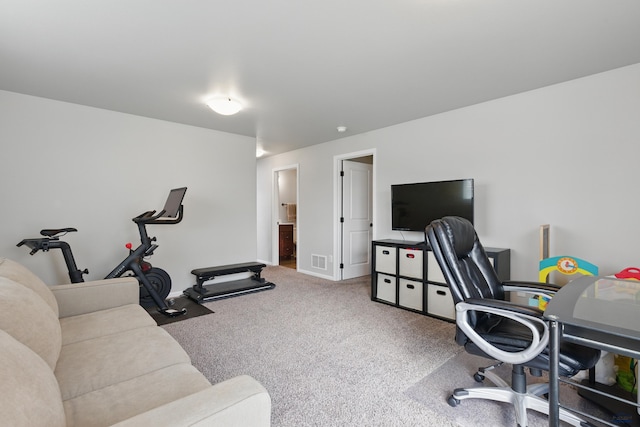carpeted home office featuring baseboards