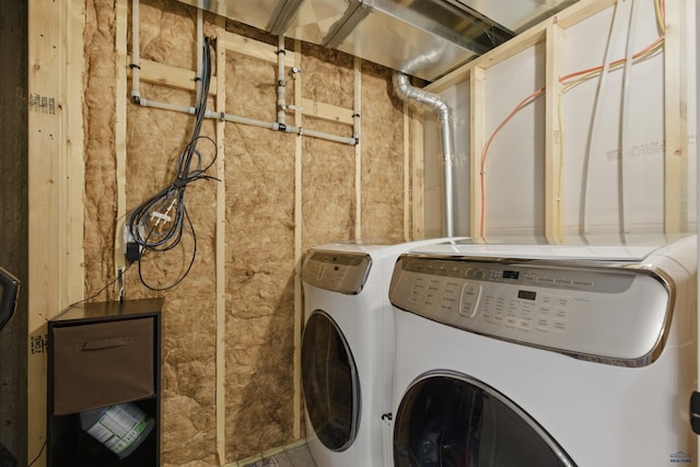 washroom with washer and dryer