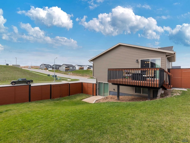 rear view of property with a wooden deck