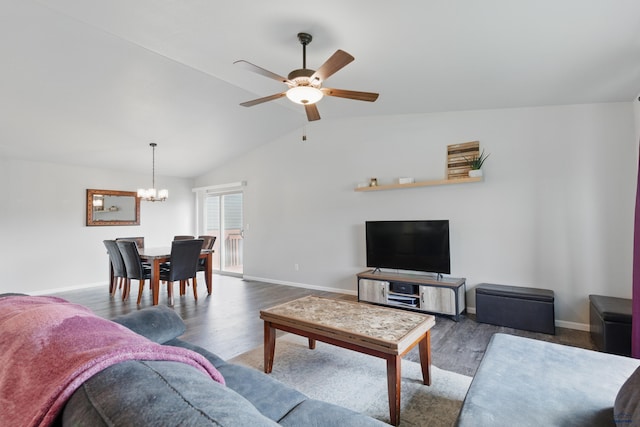 living room featuring ceiling fan, a chandelier, wood finished floors, baseboards, and lofted ceiling