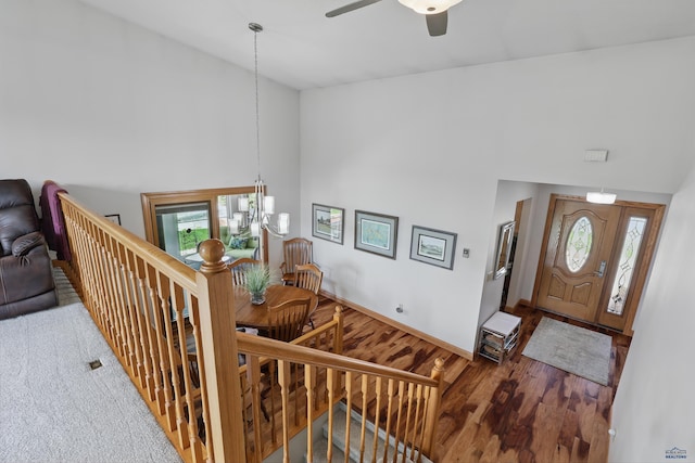 7315 Raven Ct, Rapid City, SD 57702 - entryway with a chandelier, high vaulted ceiling, wood finished floors, ceiling fan, and baseboards