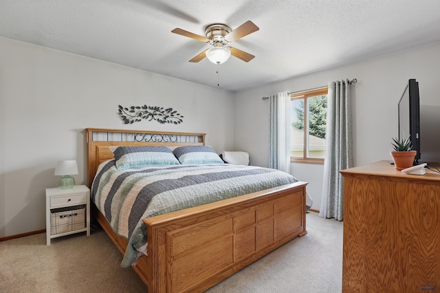 7315 Raven Ct, Rapid City, SD 57702 - bedroom with light carpet, baseboards, a ceiling fan, and a textured ceiling