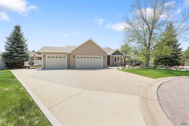 7315 Raven Ct, Rapid City, SD 57702 - ranch-style home featuring concrete driveway, an attached garage, and a front lawn