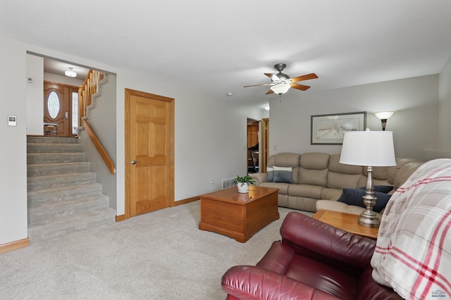 7315 Raven Ct, Rapid City, SD 57702 - living room with stairs, carpet, a ceiling fan, and baseboards
