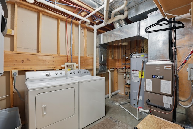 7315 Raven Ct, Rapid City, SD 57702 - clothes washing area with water heater, washer and dryer, and heating unit
