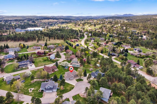 7315 Raven Ct, Rapid City, SD 57702 - aerial overview of property's location featuring nearby suburban area and a mountainous background