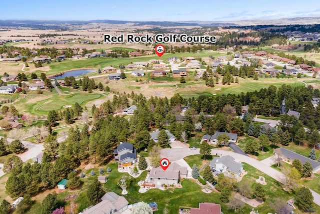7315 Raven Ct, Rapid City, SD 57702 - aerial view of property and surrounding area featuring a large body of water, nearby suburban area, and a golf course
