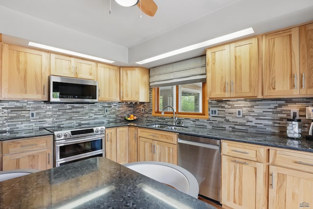 7315 Raven Ct, Rapid City, SD 57702 - kitchen featuring appliances with stainless steel finishes, a sink, light brown cabinetry, and decorative backsplash