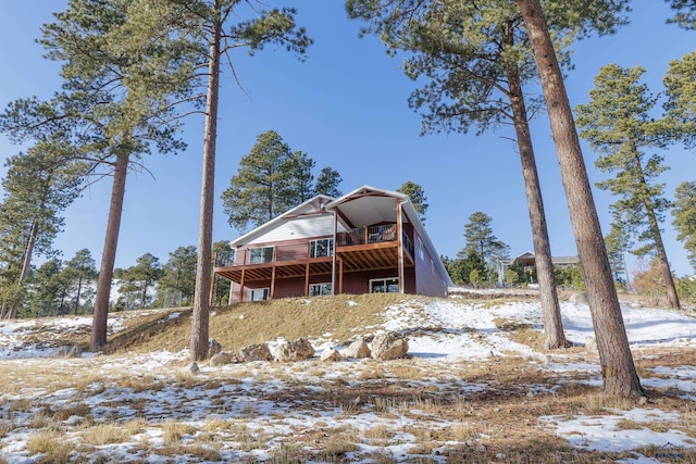 11806 St Ambrose Ct, Stugis, SD 57785 - snow covered back of property with a wooden deck