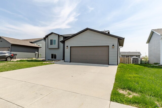 split level home featuring a garage and concrete driveway