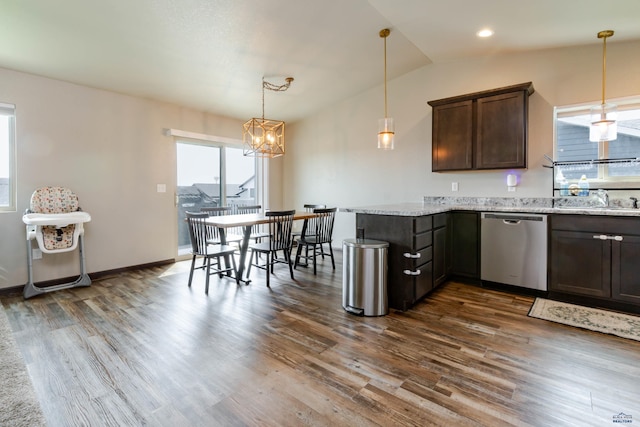 kitchen with dishwasher, dark brown cabinetry, dark wood-type flooring, a peninsula, and a sink
