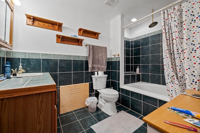 1580 Laurel Heights Dr, Rapid City, SD 57701 - bathroom with tile patterned floors, tile walls, tiled shower / bath combo, toilet, and vanity