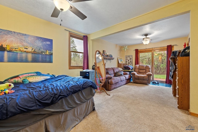 1580 Laurel Heights Dr, Rapid City, SD 57701 - carpeted bedroom featuring multiple windows, access to outside, and a ceiling fan