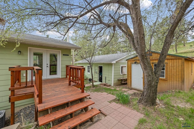 1580 Laurel Heights Dr, Rapid City, SD 57701 - back of house featuring french doors, a deck, a shingled roof, and an outbuilding