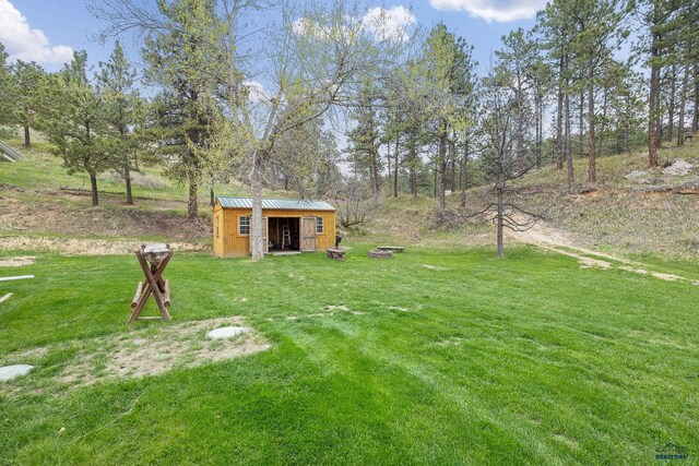 1580 Laurel Heights Dr, Rapid City, SD 57701 - view of green lawn featuring an outdoor structure and a storage shed