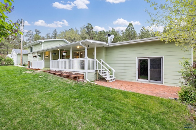 1580 Laurel Heights Dr, Rapid City, SD 57701 - rear view of house with a porch, a yard, and a patio