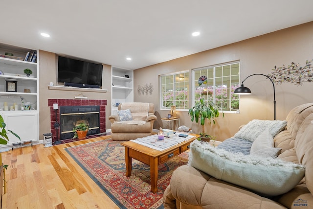 1580 Laurel Heights Dr, Rapid City, SD 57701 - living room with wood finished floors, a fireplace, and recessed lighting
