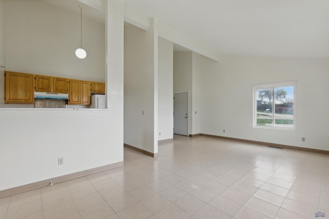 322 Curtis, Rapid City, SD 57702 - unfurnished living room featuring high vaulted ceiling and baseboards