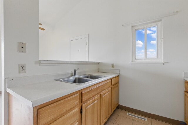 322 Curtis, Rapid City, SD 57702 - kitchen featuring a sink, light countertops, baseboards, and light tile patterned flooring