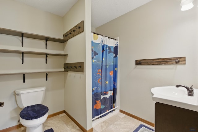 bathroom featuring toilet, baseboards, curtained shower, vanity, and tile patterned floors