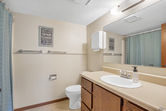 bathroom featuring a textured ceiling, toilet, vanity, and curtained shower