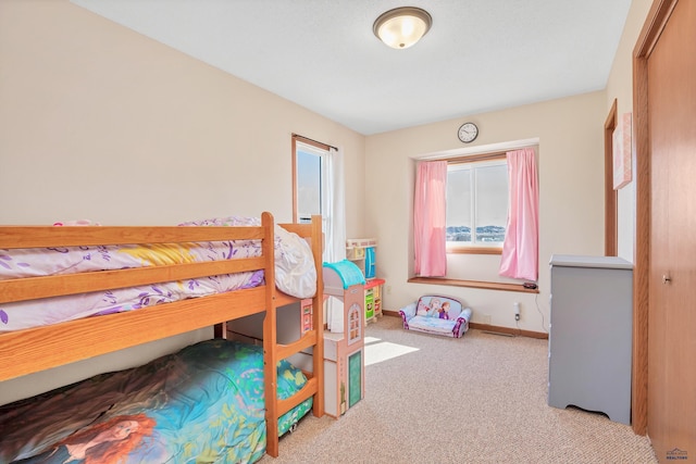 carpeted bedroom with baseboards